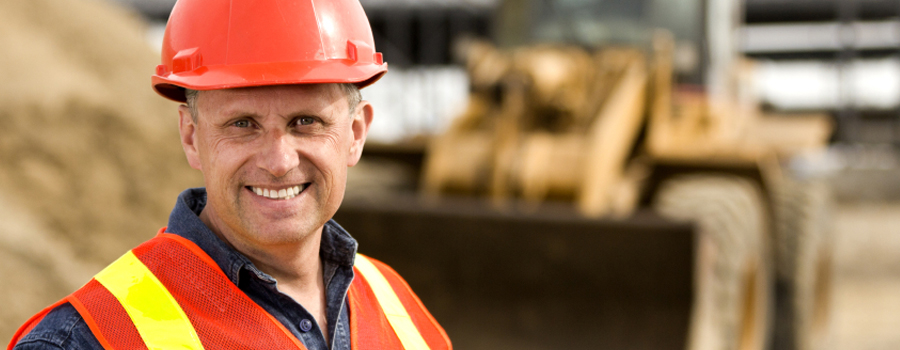 Construction man in uniform smiling