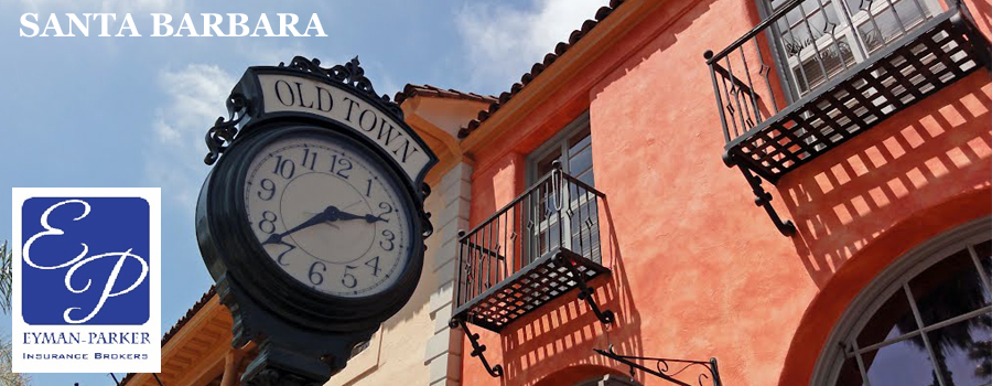 'Old Town' clock next to orange building outside in Santa Barbara